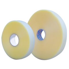 Two yellow polishing pads with white centers on a white background