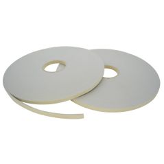 Two rolls of white foam tape on a white background