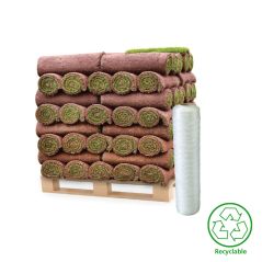 Stack of grass sod rolls on a pallet with a recyclable symbol on a white background